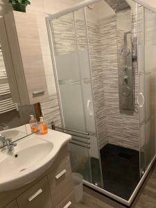 a bathroom with a shower and a sink at Residence Le Lac Blanc in Val Thorens +16 photos