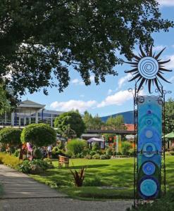 a statue of a sun in a park at Ferienwohnung HOAMAT Schmalzreich Andrea in Lam