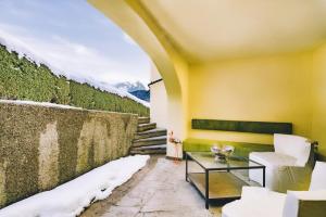 a room with a table and a wall with snow at Haus Miele in Garmisch-Partenkirchen