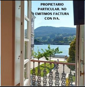 an open window with a view of the water at A&L Centro in Viveiro