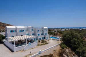 an aerial view of a large white building at Porto Villa in Vlychada