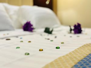 מיטה או מיטות בחדר ב-Shada Residence Hotel
