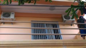 a balcony with two air conditioners and two windows at Stargazers Apartment in Olongapo