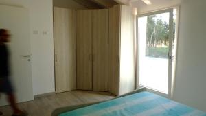 En eller flere senge i et værelse på Villetta La Caletta