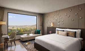 Voodi või voodid majutusasutuse Taj Amer, Jaipur toas