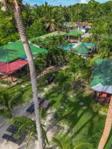 an aerial view of a resort with palm trees at Charisma Beach Resort in Siquijor
