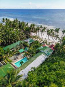 an aerial view of a resort with a beach at Charisma Beach Resort in Siquijor