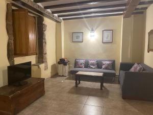 A seating area at Casa Rural Les Caixes