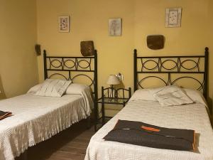 A bed or beds in a room at Casa Rural Les Caixes