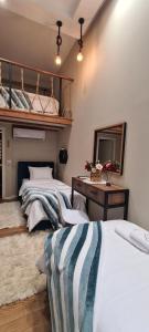 Postel nebo postele na pokoji v ubytování Duplex Rooms