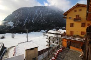 a view of a snow covered mountain from a building at Residence Aquila - Bilo Mont Nery in Brusson