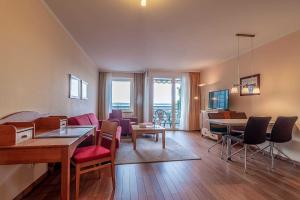 TV a/nebo společenská místnost v ubytování Hafendomicil Appartement WH07 - Fuchs