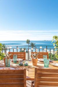 a dining table with a view of the ocean at BADIA DE ROSES 1 new apartment in Roses
