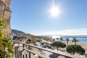 a balcony with a view of a beach and the ocean at BADIA DE ROSES 1 new apartment in Roses