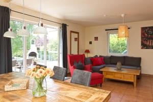 a living room with a couch and a table at Ferienhaus Fernweh in Göhren-Lebbin