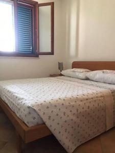 Postel nebo postele na pokoji v ubytování LiCaseDiMare