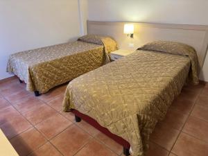 Postel nebo postele na pokoji v ubytování Domus San Bernardino