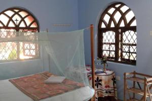 Una cama o camas en una habitación de Mayelle Agonda