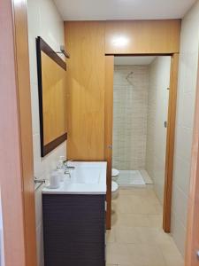 a bathroom with a sink and a toilet at Precioso loft al lado Parc Vallparadís by Lofties in Terrassa