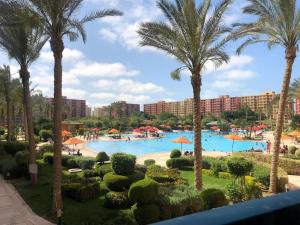a view of the pool from the balcony of a resort at Golf Porto Marina in El Alamein