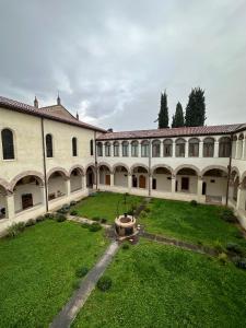 an empty courtyard of a building with a large yard at Domus San Bernardino in Verona