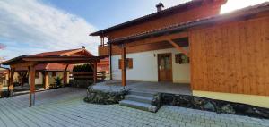 a house with a staircase leading to a porch at Ferienhaus Happyplace in Illach