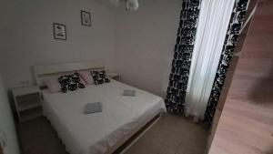 Postel nebo postele na pokoji v ubytování Apartman Novalja
