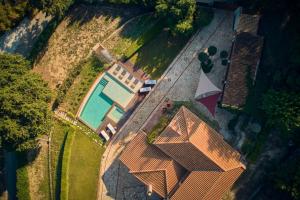 an overhead view of a house with a swimming pool at Wild Oak Estate - Stone Villa with Sea Views , by ZanteWize in Argassi