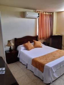 Postel nebo postele na pokoji v ubytování Hotel Khalifa