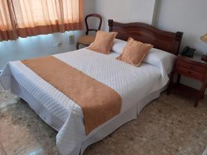Postel nebo postele na pokoji v ubytování Hotel Khalifa