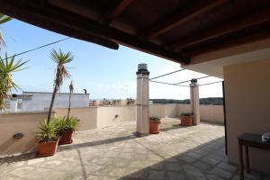 a view from the balcony of a house at Elegant Holiday Home for 67 Guests in the Heart of Otranto in Otranto
