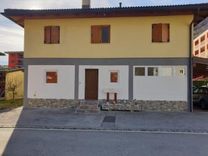 a house with a lot of windows on it at BnB Rivera-Monteceneri vicino Splash e Spa in Rivera