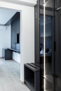 a room with a glass cabinet with a bed in it at Boutique Suites Joyce Medulin with free parking in Medulin