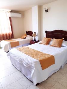Postel nebo postele na pokoji v ubytování Hotel Khalifa