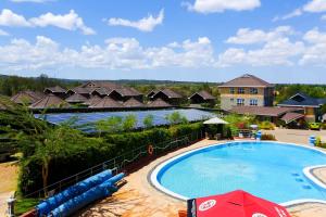 a view of a swimming pool at a resort at Aberdare Prestige & Royal Cottages in Nanyuki