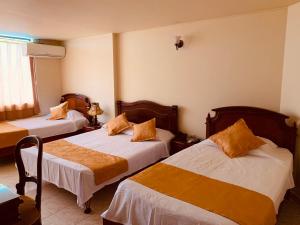 Postel nebo postele na pokoji v ubytování Hotel Khalifa