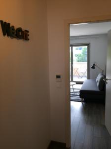 a room with a couch and a door to a patio at F2 côté UGC climatisé plein centre parking gratuit in Strasbourg