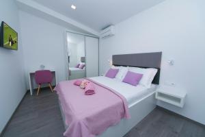 Posteľ alebo postele v izbe v ubytovaní Apartments Villa Nadalina Deluxe