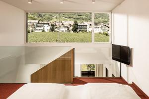 TV a/nebo společenská místnost v ubytování Hotel Traminerhof