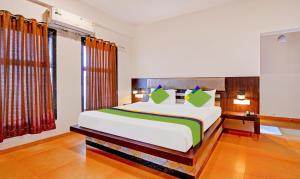 a bedroom with a large bed in a room at Treebo Vhyomaan Resort With Swimming Pool in Mahabaleshwar +27 photos