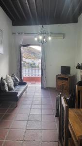 a living room with a couch and a table at Villa Alegria in Gérgal