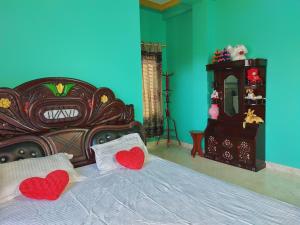 Postel nebo postele na pokoji v ubytování Tathāgata Homestay