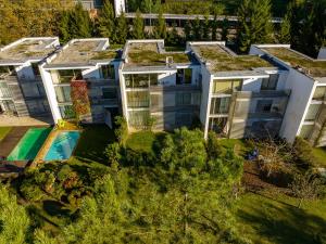 an aerial view of a house with a swimming pool at Golf Course - Luxurious Flat T3 - Ponte de Lima in Ponte de Lima