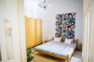 Ένα ή περισσότερα κρεβάτια σε δωμάτιο στο Sipi Apartman