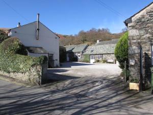 a street in a village with at farmhouse cottage in Keswick