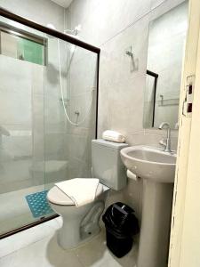 a bathroom with a toilet and a sink and a shower at Casa em Porto de Galinhas by AFT in Porto De Galinhas +12 photos