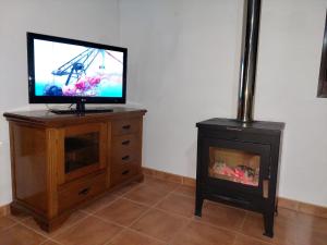 TV a/nebo společenská místnost v ubytování Casa el angel 2