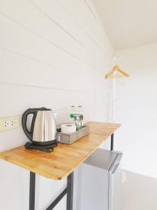 a kitchen counter with a coffee maker on top of it at 153 Mountain View in Ban Huai Phai