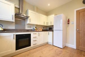 Η κουζίνα ή μικρή κουζίνα στο Sunnybrae Alnmouth +12 φωτογραφίες