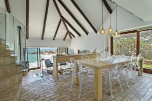 a dining room with a table and chairs at Beach Music in Llandudno